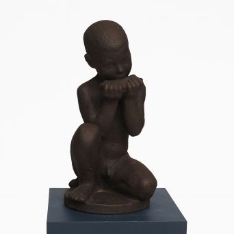 Johannes Hansen for Knabstrup. Large black ceramic figurine of a boy playing harmonica